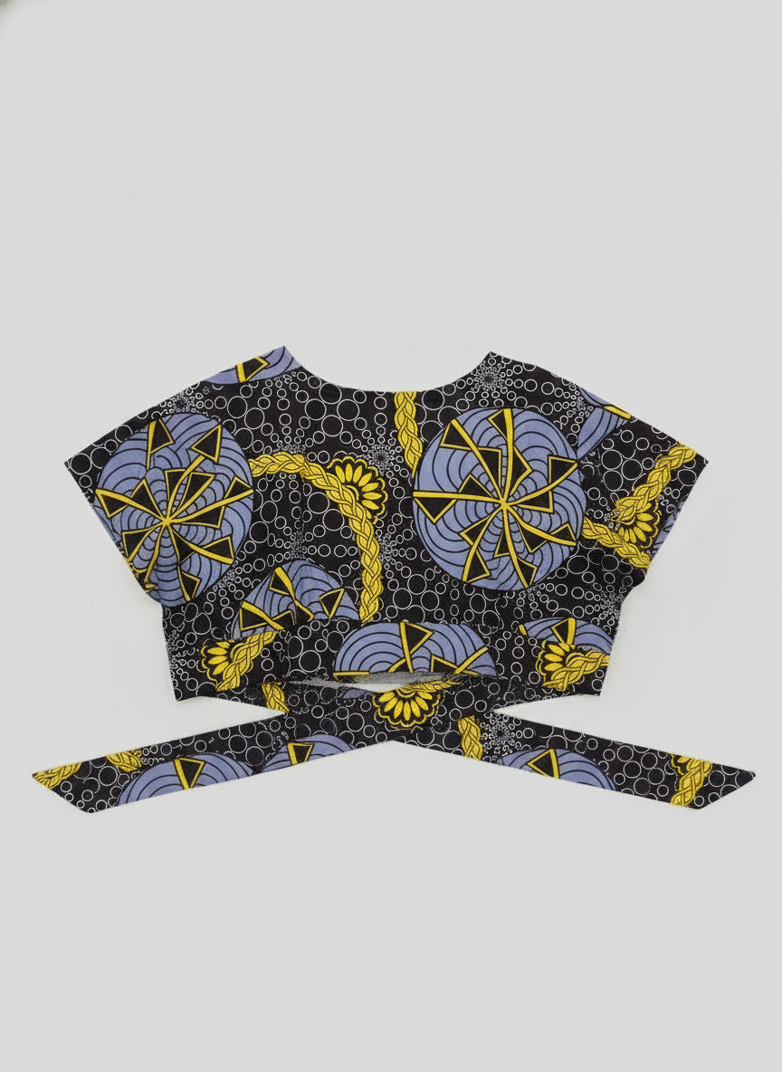 African print fabric with blue and yellow patterns on a kitchen counter.